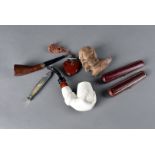 A small quantity of miscellaneous smoking items, comprising a French briar Smokarol pipe, a clay