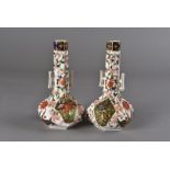 A pair of Royal Crown Derby octagonal sprinkler vases, with applied handles and decorated in the