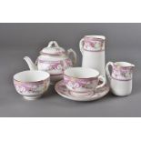 A Royal Worcester 'Bordeaux' pattern tête-à-tête tea set, decorated mainly in pink, dated 1929,