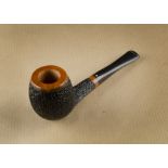 A Dr Kiess Patriot RM briar unsmoked pipe, having uniform rusticated bowl and shank, an acrylic hand