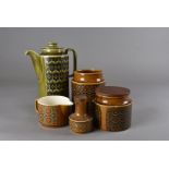 A collection of Hornsea bronte pattern storage jars, coffee cans, preserve pots and covers and a