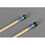 A cased pair of Edwardian knitting needles, the ivory needles of turned cylindrical form having