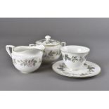 A Royal Worcester part tea set, marked 1961 and decorated in a dog rose pattern; with four cups, six