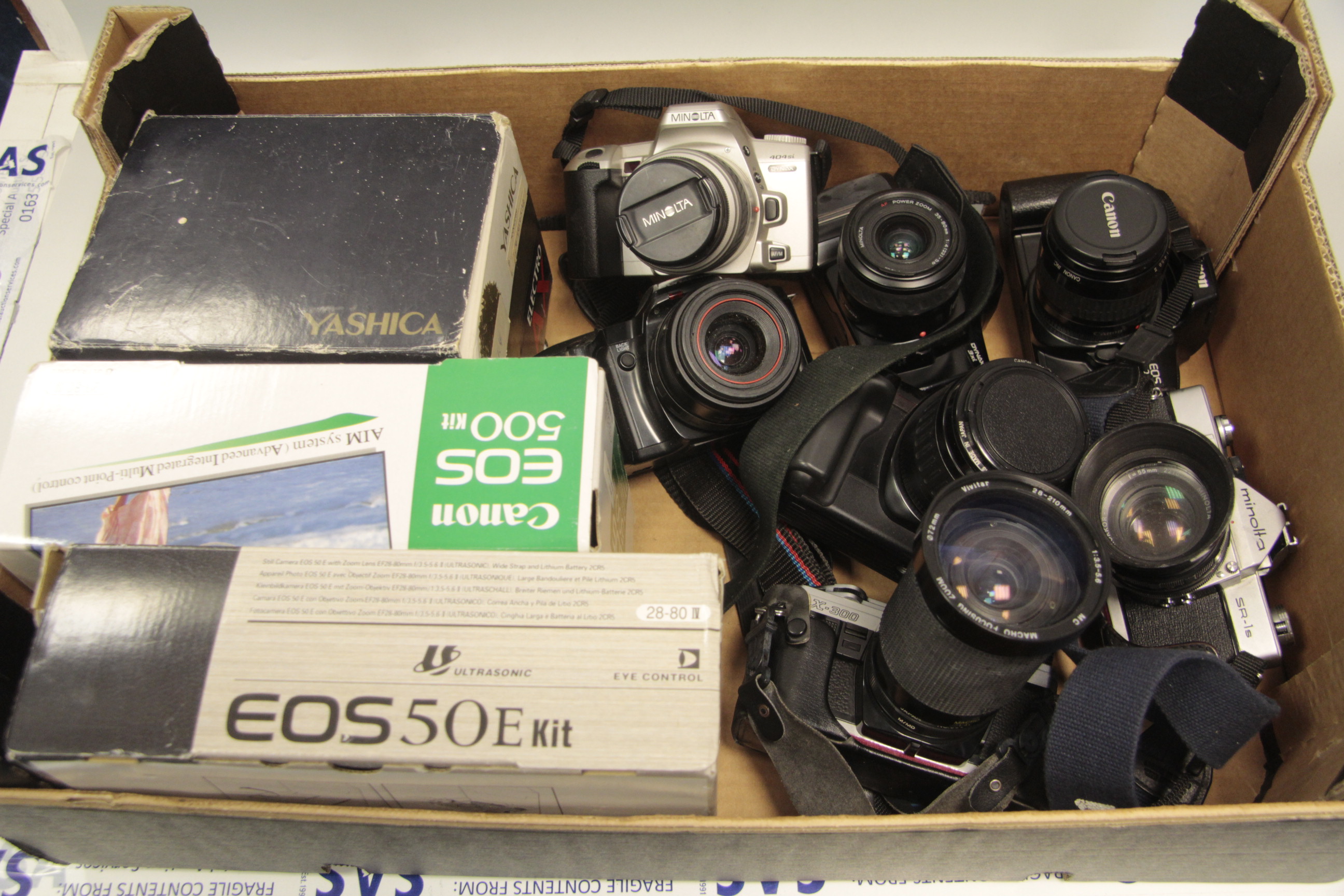 Various SLR cameras with kit lens, Mostly electriconic models, some in original boxes, examples