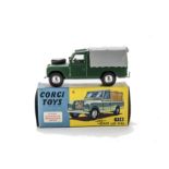 A Corgi Toys 438 Land Rover 109" W.B, dark green body, grey plastic canopy, lemon interior, spun