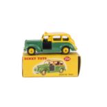 A Dinky Toys 254 Austin Taxi, two-tone issue with yellow upper body and hubs, dark green lower body,