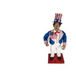 An American 'Uncle Sam' electric automaton, dressed in red white and blue, with top hat, in