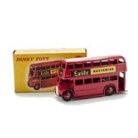 A Dinky Toys 291 London Bus 'Exide Batteries', red body and ridged hubs, logo in black and yellow,