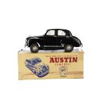 A Victory Industries 1/18 Austin Somerset, battery-operated plastic model with black body, red