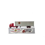 A Dinky Supertoys 948 McLean Tractor Trailer, red cab, light grey trailer, red plastic hubs, in