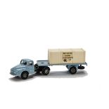 A Tri-ang Spot-On No.106a/0c Austin Flatbed Lorry With Crate, light blue cab and trailer, black