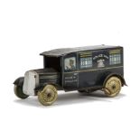 A Wells Tinplate Clockwork Police Van, dark blue detailed tin printed body, balloon tyres, silver