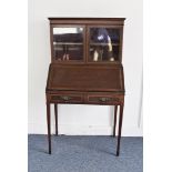 An Edwardian mahogany and strung small bureau bookcase, 137cm high and 74cm wide, in two sections