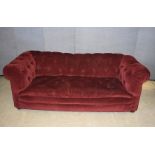 An early 20th Century chesterfield, with button back, stained beech feet, in need of attention200 cm