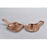 Two Newlyn copper arts and crafts chamber sticks, one of square design embossed with a pair of