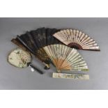 A Japanese Meiji period bone and silk fan, with carved iris guards and iris painted decoration
