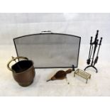 A collection of fire furniture, including a brass and copper helmet coal scuttle, fire screen,