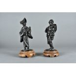A pair of Meiji period Japanese bronze figures, one of a female musician, 17 cm high the other of