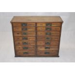 A 19th Century double mahogany chest of seven graduated drawers, ex shop counter, with drop recessed