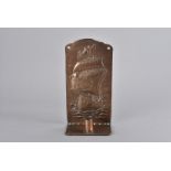 A Newlyn copper arts and crafts wall sconce, of rectangular shape, having embossed decoration of a