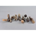 Four Black Forest carved bear bottle stoppers, one from St Moritz, together with a quantity of