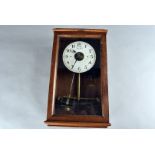 A Bulle-Clock electric wall clock, the mahogany case, with glazed front to reveal face with Arabic