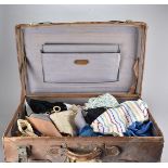 An Edwardian leather travelling suitcase, with various labels, 66 cm x 41 cm x 24 cm high