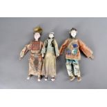 Three 19th Century Chinese wooden and plaster costume dolls, two wearing fine court dress with