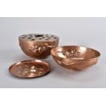 A Newlyn copper arts and crafts circular rose bowl, with embossed apple design and pierced top,