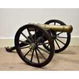 A mid 20th Century scratch built field artillery cannon, the truncated brass cone supported on