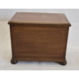 An Edwardian mahogany satin and chequered strung small casket, with hinged lid on stepped base and