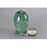 A large Victorian green glass dump, of ovoid form with bubble inclusion, approximately 10 cm x 15 cm
