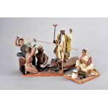 A collection of seven North West Indian terracotta figures, depicting general day to day life, to
