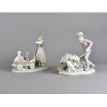 Two Lladro figure groups of children, boy pushing wheelbarrow laden with straw with dog, 22 cm