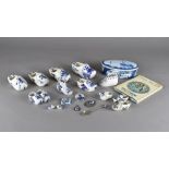 A quantity of white metal and Delft mounted jewellery, and pottery clogs
