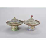 Two Chinese copper lotus leaf footed bowls and cover, both decorated with enamel, having floral