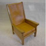 Robert Thompson of Kilburn, known as The Mouseman, an oak and leather easy chair with high back,