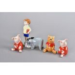 A group of five Beswick Walt Disney Winnie the Pooh figures, including Pooh, Christopher Robin,