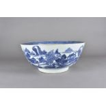 An 18th Century Chinese blue and white export footed punch bowl, painted with landscapes and