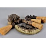 A collection of six Black Forest carved bear mounted table brushes, largest 19 cm (6)