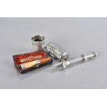 An Art Deco chromed owl car mascot, together with a silver, meerschaum and amber cheroot holder in a