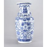 A large Chinese blue and white ceramic vase, decorated with fruit and flower bud, having raised