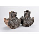 A pair of late 19th century Asian carved hardwood stirrups, possibly ceremonial examples from