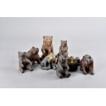 A collection of nine Black Forest carved bears, all modelled seated, largest, 12.5 cm high (9)