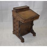 A Victorian walnut inlaid davenport, with leather inset top, four drawers matched by dummies, 53