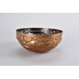 A Newlyn copper arts and crafts bowl, the all over planished body having upper section decorated