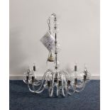 A modern Czech glass chandelier, having twelve sconce branches with faux flame bulbs, 86 cm high x