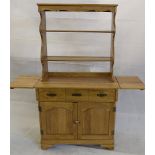 A modern oak dresser, the base with a frieze drawer above a pair of panel doors on bracket feet