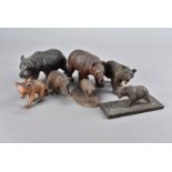 A collection of seven Black Forest carved bears, all modelled walking, some with glass eyes and