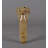 A 17th Century Chinese agate tear vase, the ovoid slender body with inverted neck and flared rim